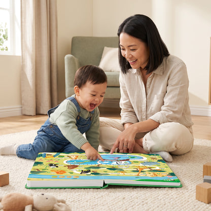 Mother and toddler sitting on the floor exploring the 500 Words Sound Book together, screen-free play