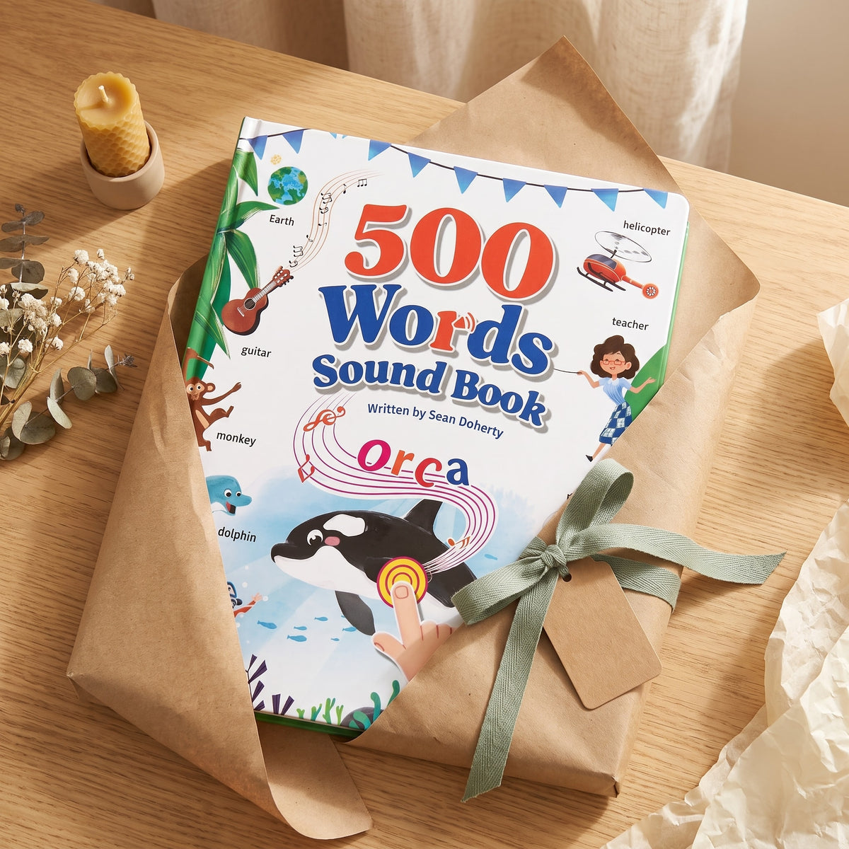 500 Words Sound Book wrapped as a gift in kraft paper with a sage ribbon, a present for little learners
